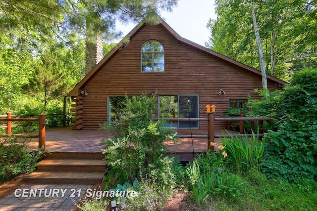 13715 Baldwin Rd, Saginaw, MI 48616 - rear view of house with a deck, a chimney, and log exterior