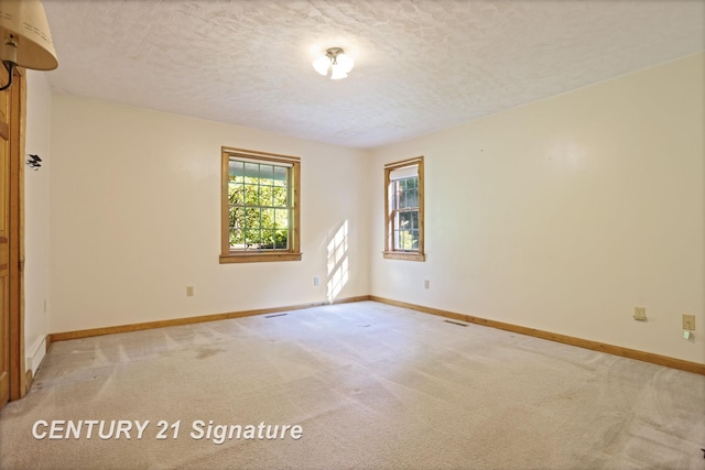 13715 Baldwin Rd, Saginaw, MI 48616 - spare room with light carpet and a textured ceiling