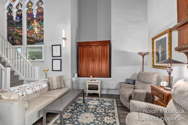 253 Prospect Ave NE Unit 309, Grand Rapids, MI 49503 - living area featuring wood finished floors, stairs, and a high ceiling