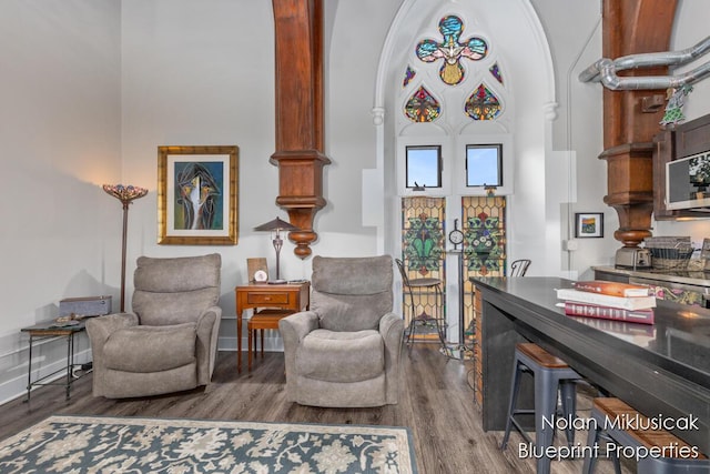 253 Prospect Ave NE Unit 309, Grand Rapids, MI 49503 - sitting room with wood finished floors and arched walkways