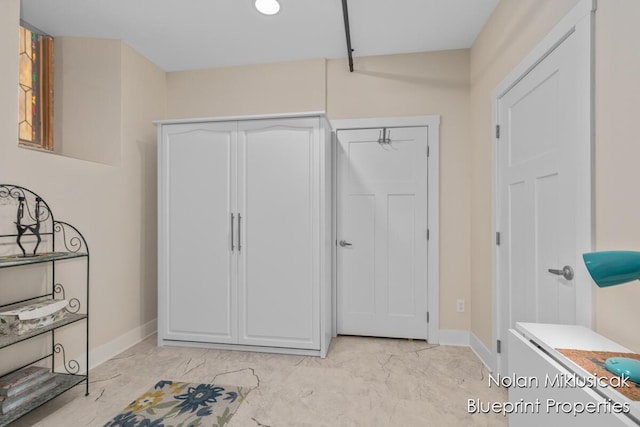 253 Prospect Ave NE Unit 309, Grand Rapids, MI 49503 - foyer with baseboards and light marble finish flooring