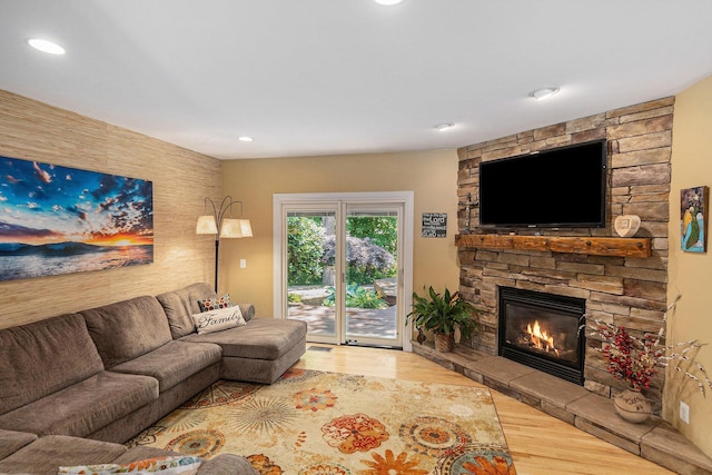 5920 Iris Rd, Ludington, MI 49431 - living area featuring wood finished floors, a fireplace, and recessed lighting