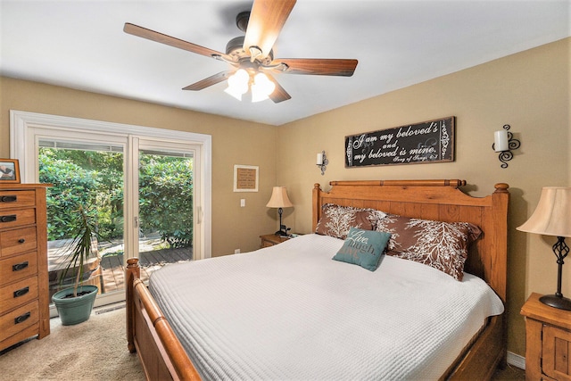 5920 Iris Rd, Ludington, MI 49431 - bedroom with access to exterior, carpet, and ceiling fan