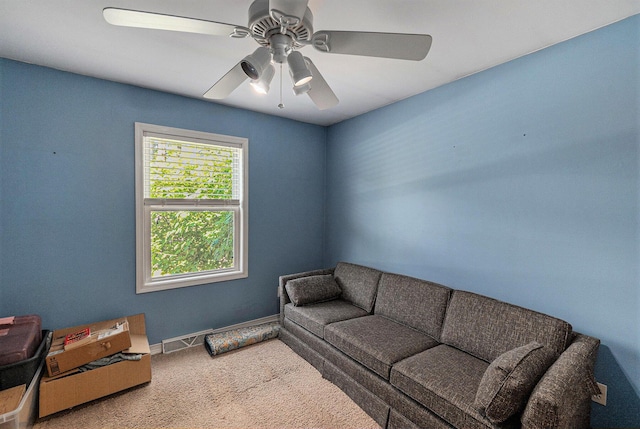 5920 Iris Rd, Ludington, MI 49431 - living room featuring carpet and ceiling fan