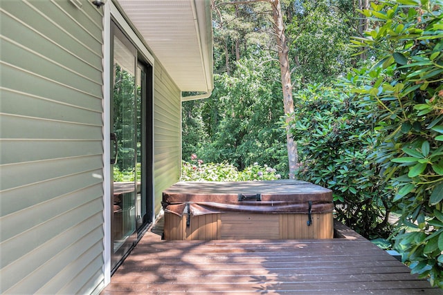5920 Iris Rd, Ludington, MI 49431 - wooden deck with a hot tub