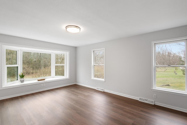 10833 W O Ave, Michigan, MI 49071 - spare room featuring dark wood-type flooring and baseboards
