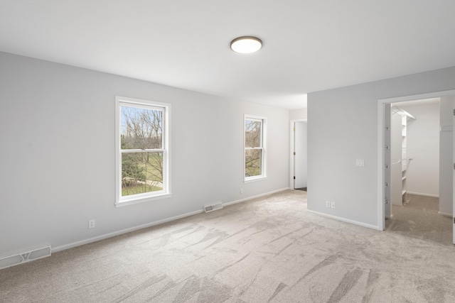 10833 W O Ave, Michigan, MI 49071 - unfurnished bedroom with multiple windows, carpet flooring, and a spacious closet