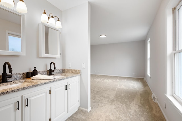 10833 W O Ave, Michigan, MI 49071 - bathroom with double vanity and baseboards