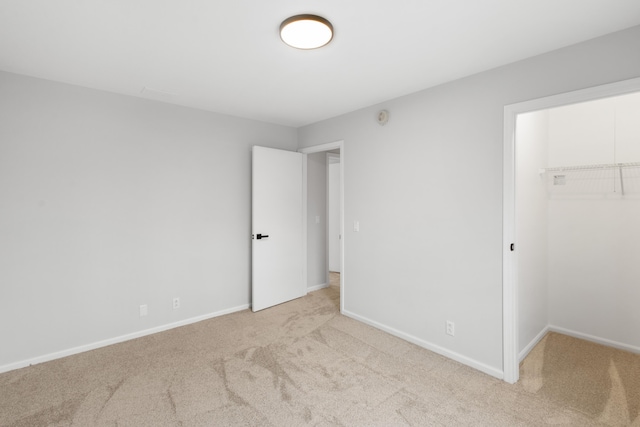 10833 W O Ave, Michigan, MI 49071 - unfurnished bedroom featuring carpet, a walk in closet, and a closet