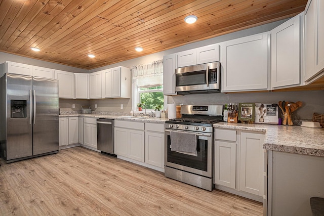 24984 Marcellus Hwy, Dowagiac, MI 49047 - kitchen featuring appliances with stainless steel finishes, wood ceiling, light wood-type flooring, recessed lighting, and white cabinetry