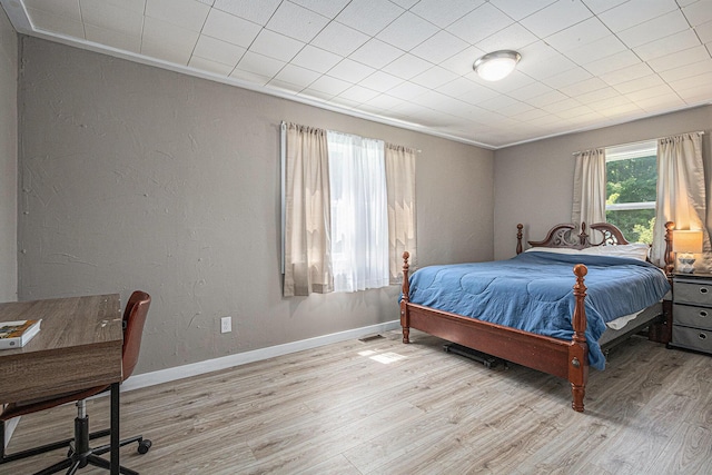 24984 Marcellus Hwy, Dowagiac, MI 49047 - bedroom with light wood-type flooring, ornamental molding, and an office area
