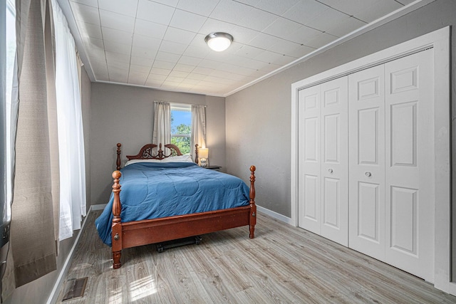 24984 Marcellus Hwy, Dowagiac, MI 49047 - bedroom featuring wood finished floors, ornamental molding, and a closet