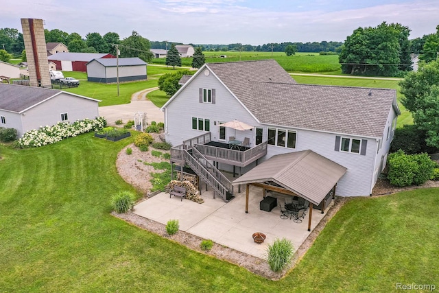 2086 Haines Rd, Lapeer, MI 48446 - back of property with a patio area, a wooden deck, a yard, stairway, and roof with shingles