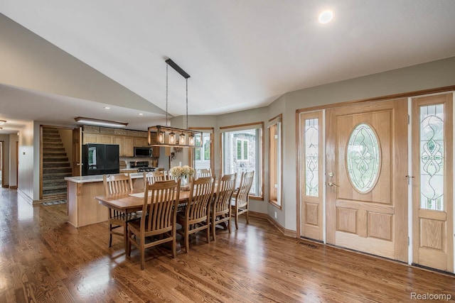 2086 Haines Rd, Lapeer, MI 48446 - dining room with wood finished floors, vaulted ceiling, stairs, and recessed lighting