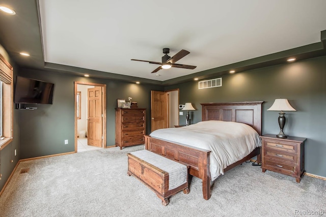 2086 Haines Rd, Lapeer, MI 48446 - bedroom with light carpet, recessed lighting, a raised ceiling, a ceiling fan, and ensuite bath