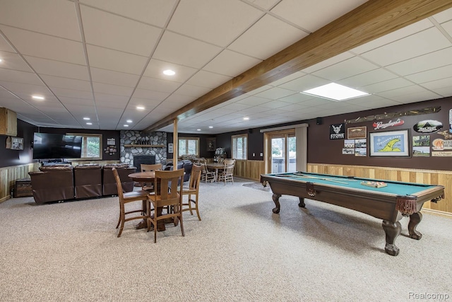 2086 Haines Rd, Lapeer, MI 48446 - game room with carpet, pool table, a paneled ceiling, a stone fireplace, and wainscoting