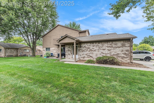 41455 Clinton Grove Dr, Clinton Township, MI 48038 - view of front of property featuring a front yard, brick siding, and a shingled roof