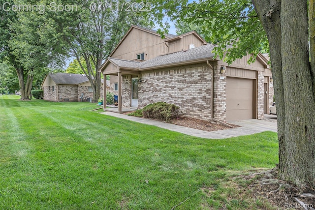 41455 Clinton Grove Dr, Clinton Township, MI 48038 - view of front facade with brick siding, an attached garage, a front yard, and roof with shingles