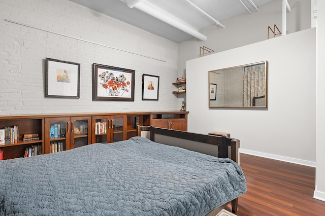 125 S Kalamazoo Mall Unit 603, Kalamazoo, MI 49007 - bedroom with wood finished floors and brick wall