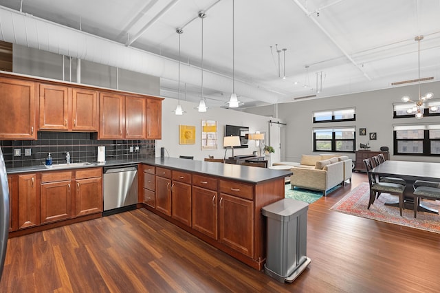 125 S Kalamazoo Mall Unit 603, Kalamazoo, MI 49007 - kitchen with dishwasher, dark wood-style floors, a peninsula, and brown cabinetry