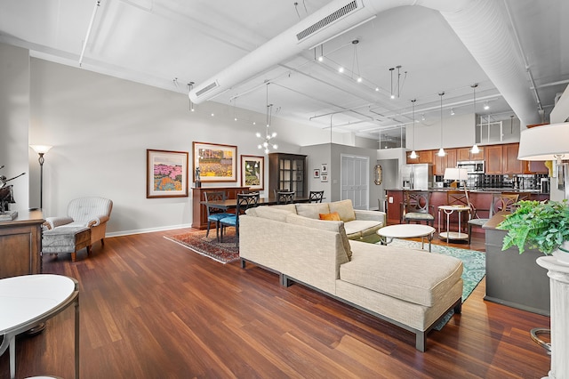 125 S Kalamazoo Mall Unit 603, Kalamazoo, MI 49007 - living area featuring dark wood finished floors and baseboards