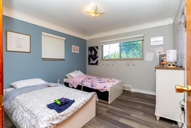 8345 E 14 Mile Rd, Sterling Heights, MI 48312 - bedroom featuring dark wood-type flooring and baseboards