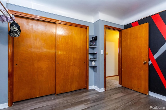 8345 E 14 Mile Rd, Sterling Heights, MI 48312 - unfurnished bedroom with wood finished floors and a closet