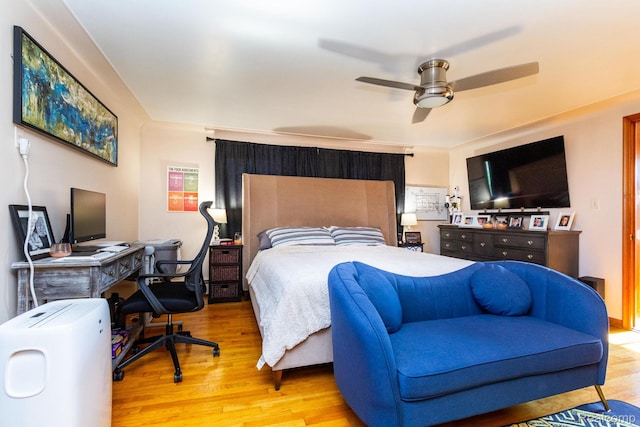 8345 E 14 Mile Rd, Sterling Heights, MI 48312 - bedroom with wood finished floors, an office area, and ceiling fan