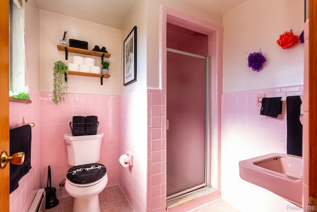 8345 E 14 Mile Rd, Sterling Heights, MI 48312 - bathroom featuring tile walls, a stall shower, wainscoting, a baseboard radiator, and tile patterned flooring