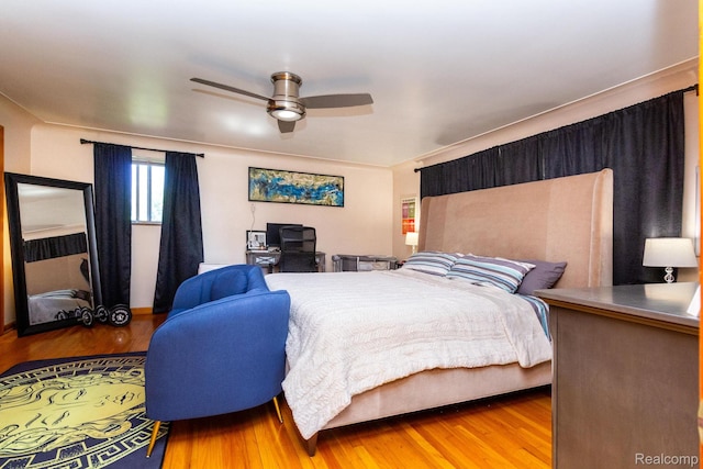 8345 E 14 Mile Rd, Sterling Heights, MI 48312 - bedroom with wood finished floors and ceiling fan