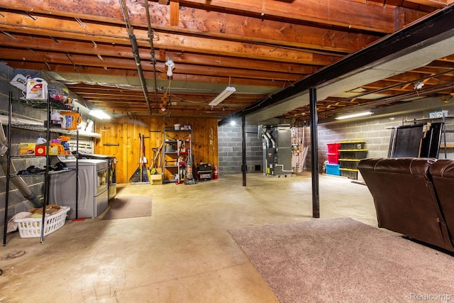 8345 E 14 Mile Rd, Sterling Heights, MI 48312 - unfinished basement with heating unit, washer and clothes dryer, and concrete block wall