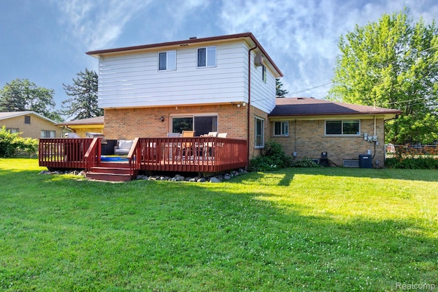 8345 E 14 Mile Rd, Sterling Heights, MI 48312 - rear view of property with brick siding, a yard, and a deck