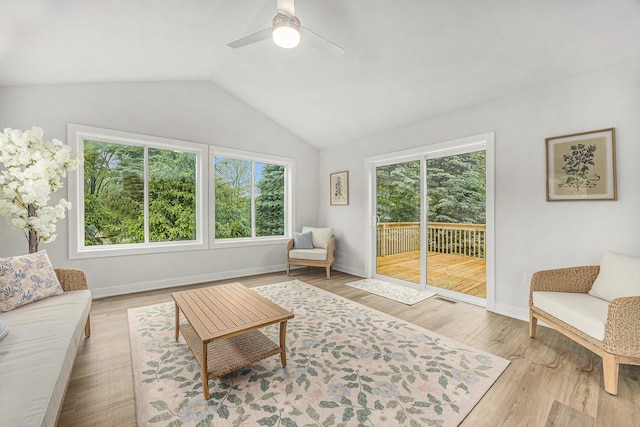LOT99 Rose Ridge Dr, Rockford, MI 49341 - living room featuring healthy amount of natural light, vaulted ceiling, a ceiling fan, and wood finished floors