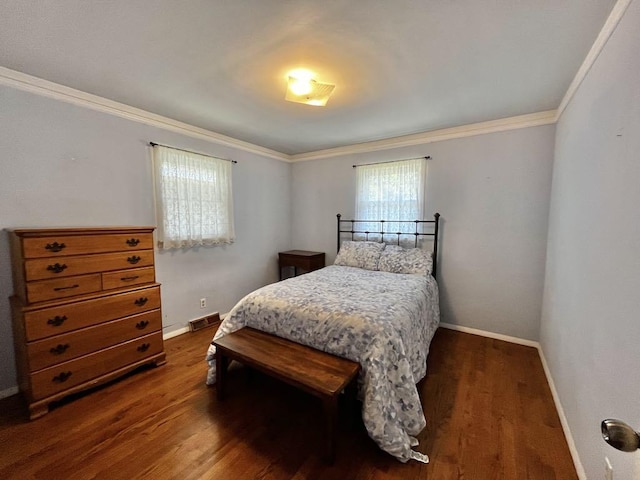 3304 Wanda Ave, Muskegon, MI 49442 - bedroom with multiple windows, dark wood-style floors, and ornamental molding