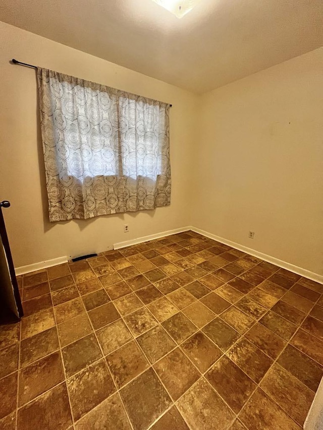 3304 Wanda Ave, Muskegon, MI 49442 - spare room featuring baseboards