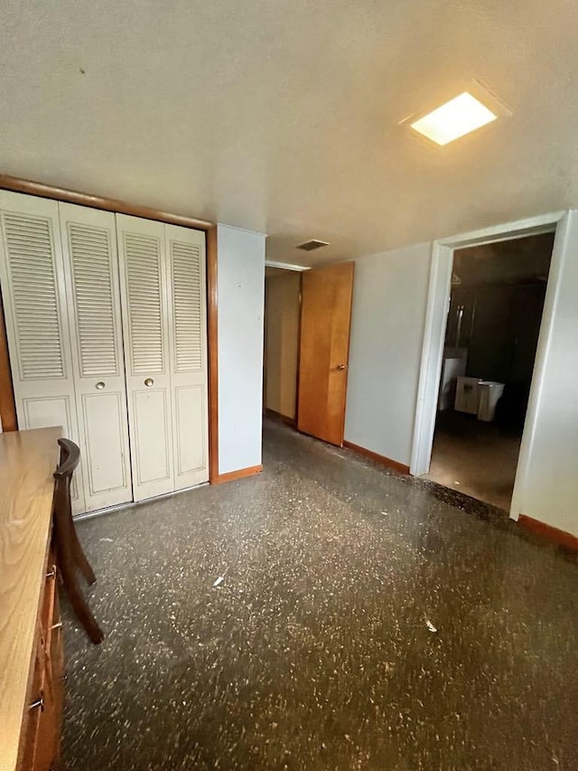 3304 Wanda Ave, Muskegon, MI 49442 - unfurnished bedroom with baseboards and a closet