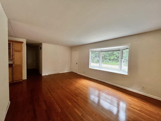 3304 Wanda Ave, Muskegon, MI 49442 - unfurnished room featuring wood finished floors and baseboards