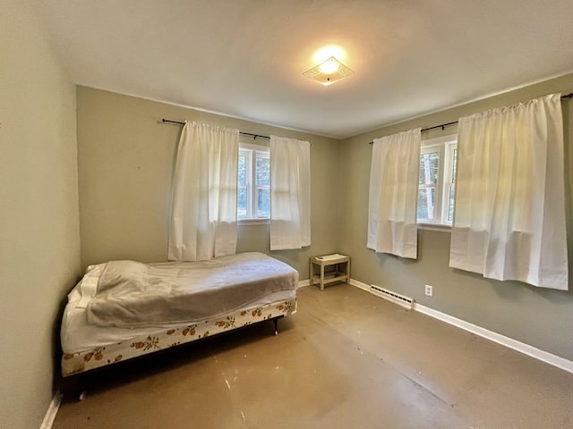 3304 Wanda Ave, Muskegon, MI 49442 - bedroom featuring baseboards and a baseboard heating unit