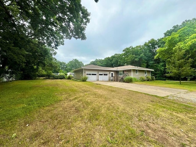 3304 Wanda Ave, Muskegon, MI 49442 - view of front of home featuring driveway, an attached garage, and a front yard