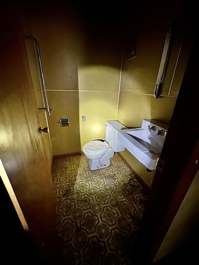 3803 64th St, Holland, MI 49423 - bathroom featuring washer / clothes dryer and toilet