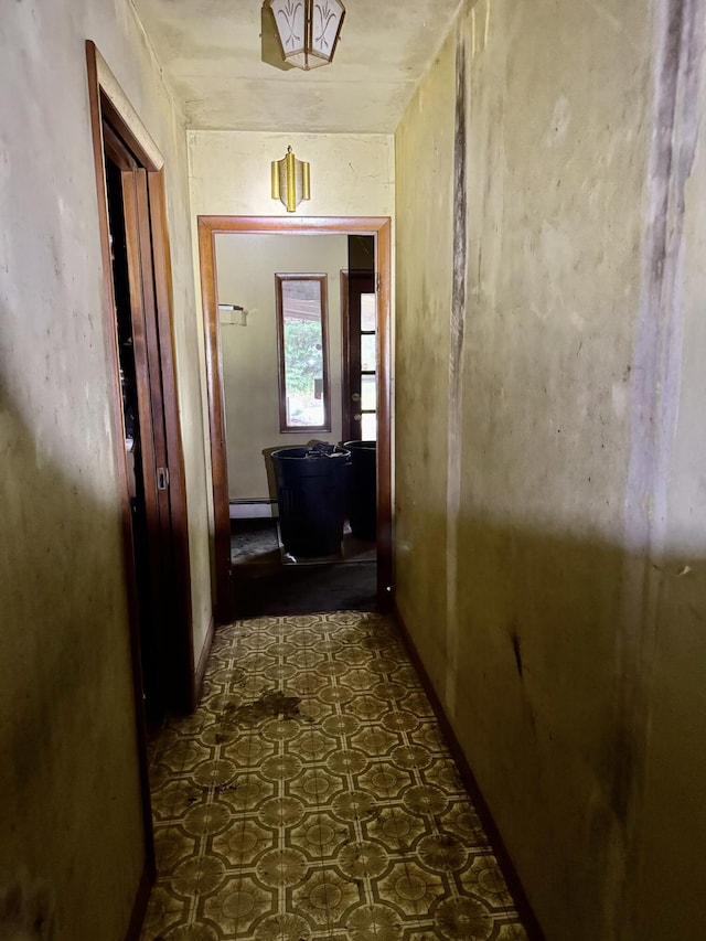 3803 64th St, Holland, MI 49423 - hall featuring dark floors and baseboard heating