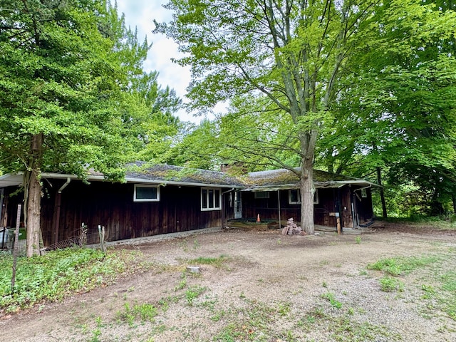 3803 64th St, Holland, MI 49423 - rear view of property with a chimney