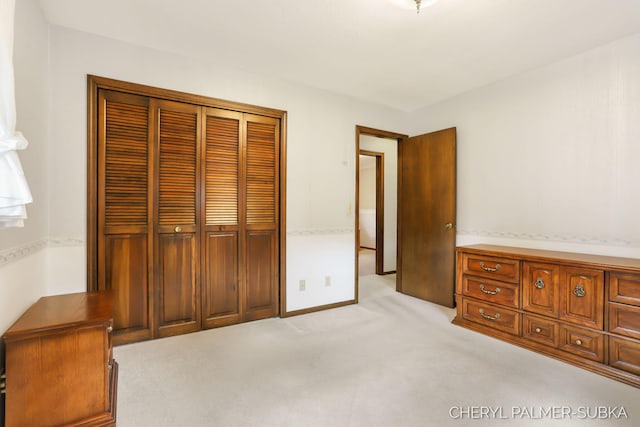 1838 Kings Ct, Muskegon, MI 49445 - unfurnished bedroom featuring a closet and light carpet