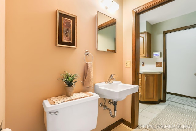 1838 Kings Ct, Muskegon, MI 49445 - half bathroom with toilet and tile patterned floors