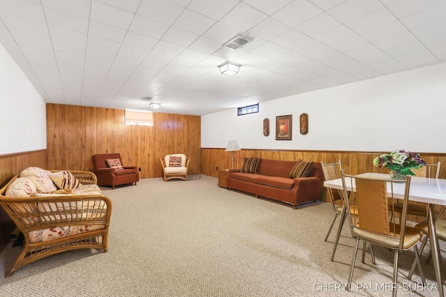 1838 Kings Ct, Muskegon, MI 49445 - carpeted living room featuring wood walls and wainscoting