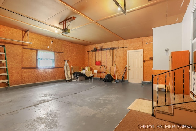 1838 Kings Ct, Muskegon, MI 49445 - garage featuring a garage door opener