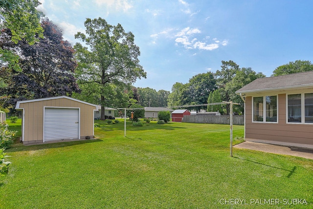 1838 Kings Ct, Muskegon, MI 49445 - view of yard with a storage unit and view of wooded area