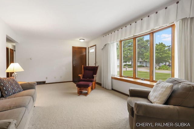 1838 Kings Ct, Muskegon, MI 49445 - carpeted living room featuring baseboards