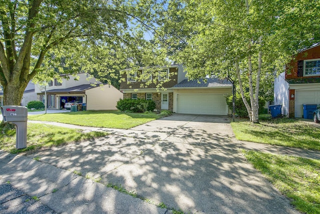 1796 Norfolk Ave, Ypsilanti, MI 48198 - view of front facade featuring concrete driveway, an attached garage, a front yard, and brick siding
