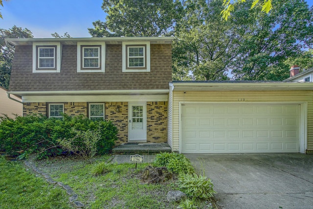 1796 Norfolk Ave, Ypsilanti, MI 48198 - view of front of home featuring concrete driveway, a shingled roof, and a garage